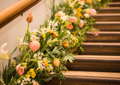 Flowers going up the side of stairway